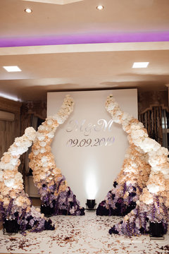 Wedding photo zone. Beautifully decorated fotozone for a wedding celebration in a restaurant.  Beautiful wedding ceremony. Place of celebration