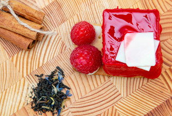 stylish new creative raspberry cake on a wooden background
