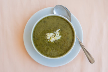 Green cream soup from spinach, close up