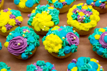 Tasty cupcakes on a white wooden table