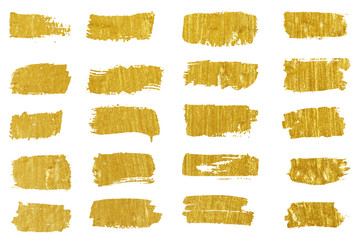 Obraz premium Collection of golden paint strokes. Grunge abstract hand painted element gold strokes with a brush.
