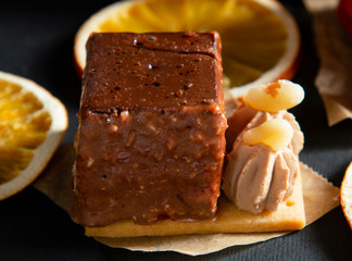 new stylish beautiful chocolate cake on a dark background