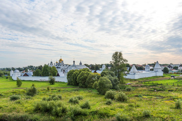 Fototapeta na wymiar Picturesque summer view of medieval Intercession (Pokrovsky) Monastery in Suzdal.The Golden Ring of Russia.