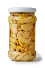 Marinated pickled champignon mushrooms (Agaricus bisporus) in jar isolated on white background
