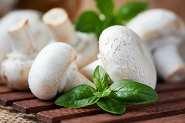 Raw organic champignon mushrooms (Agaricus bisporus) on table