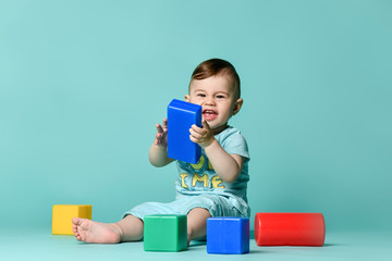 little boy child toddler playing with block toys