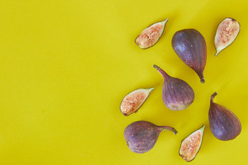 Fresh figs isolated on yellow background