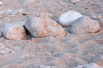 Beach of the Wreck, Zakynthos. Stones and rocks smoothed by the sea on the splendid sand of the most famous beach in Greece.