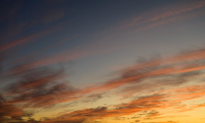Sunset sky with orange clouds. Nature background.
