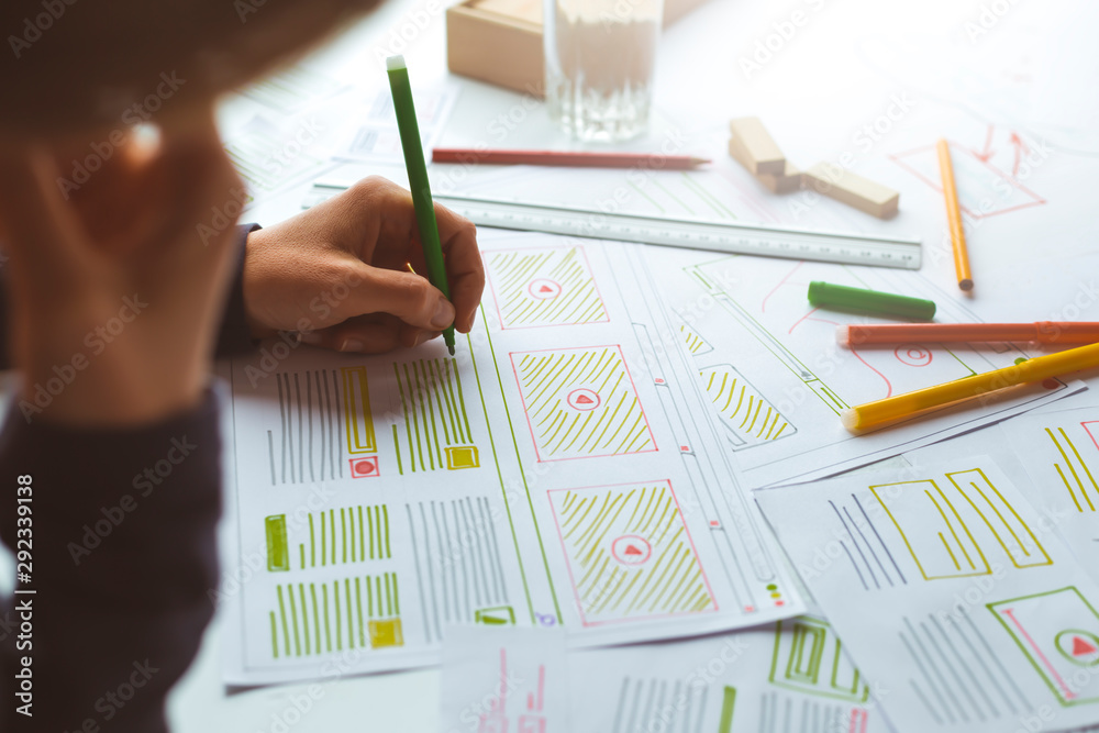 Poster website designer creates a sketch application. developing a project drawing an interface mockup.