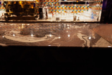 Bar counter made of gold-colored marble