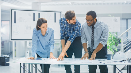 In the Industrial Engineering Facility: Diverse Group of Engineers and Technicians on a Meeting...