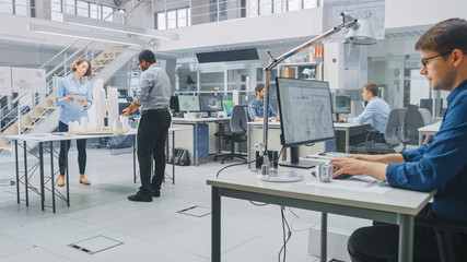 In Architectural Bureau: Team of Architects and Engineers Working on a Building Complex Prototype...