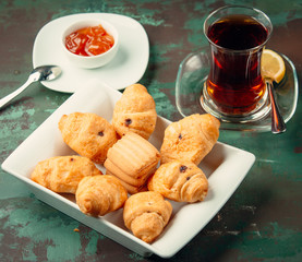 Butter cookies with raisin served with tea and jam