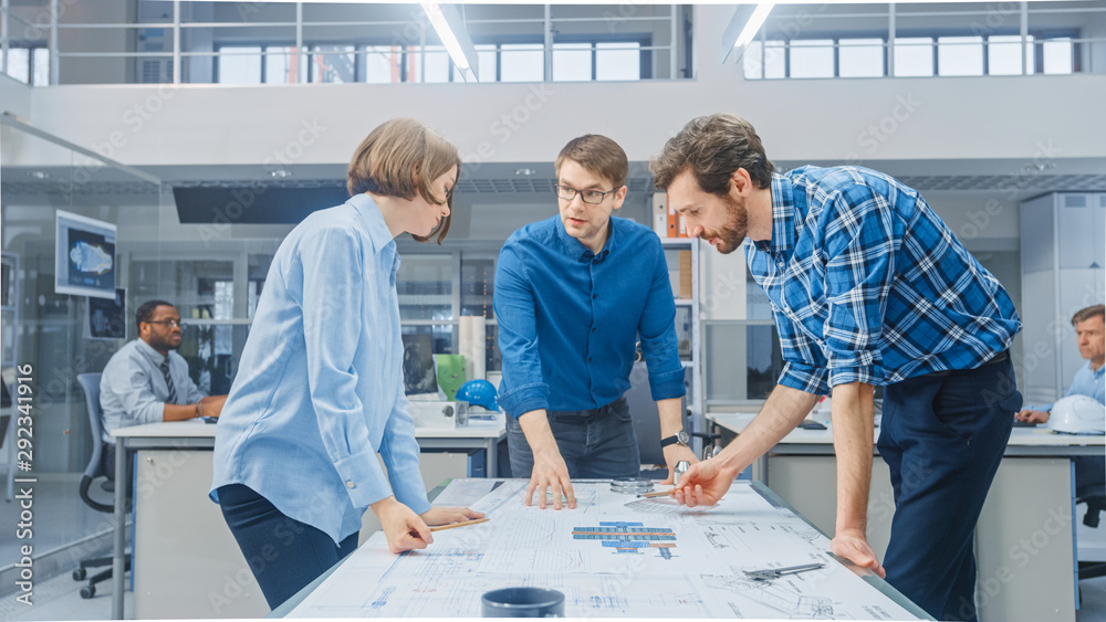 Poster in the industrial engineering facility: female designer works with industrial engineer and master te
