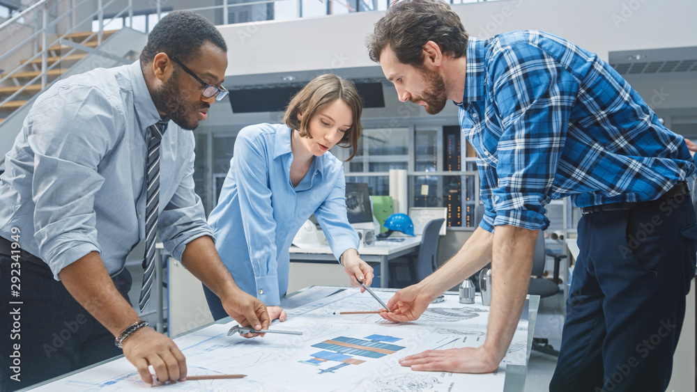 Poster in the industrial engineering facility: female designer works with industrial engineer and master te