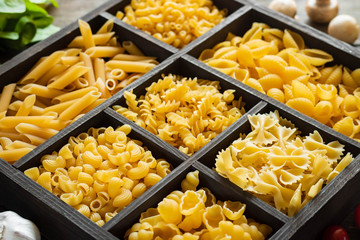 Different types of raw pasta. Italian food. Healthy food background concept.