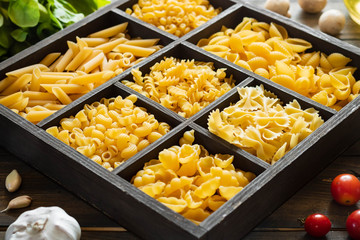 Different types of raw pasta. Italian food. Healthy food background concept.