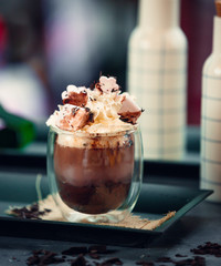 Chocolate mousse with whipped cream and marshmallow on top