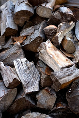 Pile of wooden logs. Selective focus, close-up.