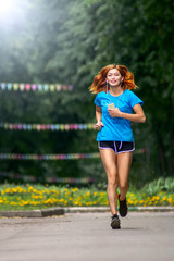Obraz premium young asian woman with Red hair jogging in a city park