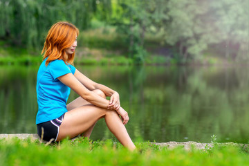 portrait asian outdoor girl posing in the green park near lake