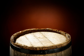 Wooden old retro barrel and mood brown blurred background 