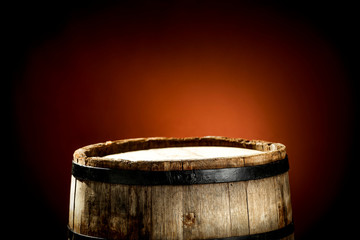 Wooden old retro barrel and mood brown blurred background 