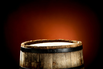 Obraz premium Wooden old retro barrel and mood brown blurred background 