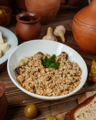 Minced meat mix with crushed walnut on top of the grilled chicken