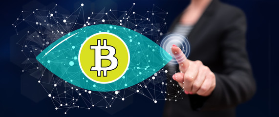 Woman touching a bitcoin concept