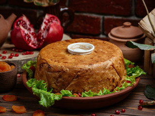 Shah pilaf rice in lavash crust decorated with pomegranate