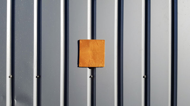 Metal sheet for roofing and background wall. Curve metal texture, table of steel sheet. Selective focus Texture for art backdrop add text or graphic design. Corrugated metal sheet door in silver