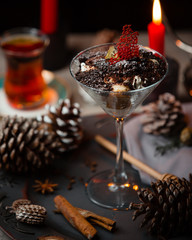 Tiramisu in martini glass served with black tea for christmas table