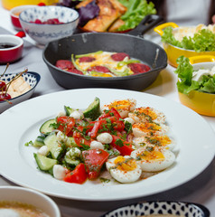 Turkish breakfast plate with boiled eggs, tomato, cucumber