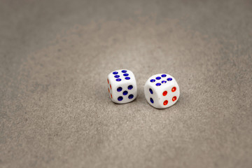 two white dice isolated on a grey background