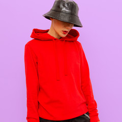 Girl in a sweatshirt and panama hat. Urban fashion style
