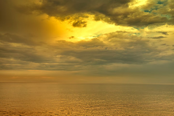 Exciting sunset. Beautiful colorful clouds over the sea.