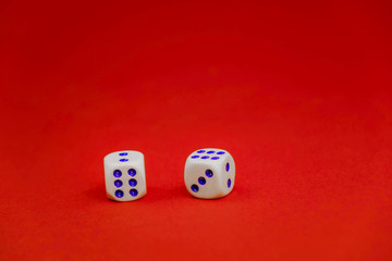 two white dice on a red background