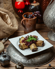 Aubergine roll with creamy cheese and walnut