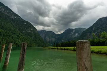 Fototapeta na wymiar a mountain lake with blue green water and many trees