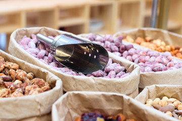 Counter of sweet tasty nuts. Selective soft focus.