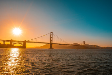 Fototapeta na wymiar San Francisco, California / United States »; August 2019: Golden Gate of San Francisco and the sun in a beautiful sunset