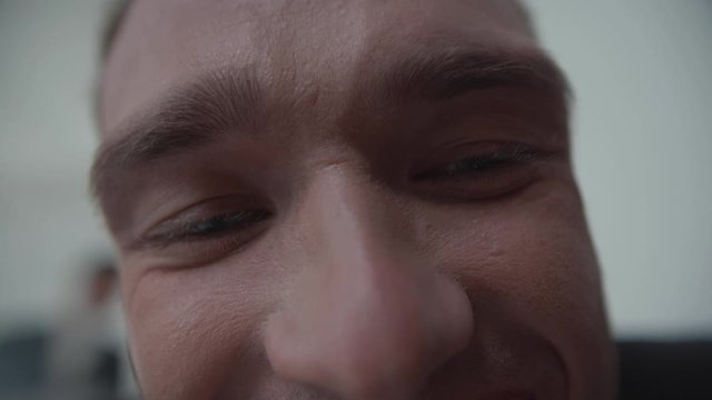 Focus on man with a gnashing teeth.