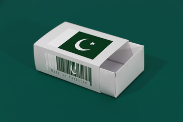 Pakistan flag on white box with barcode and the color of nation flag on green background, paper packaging for put match or products.