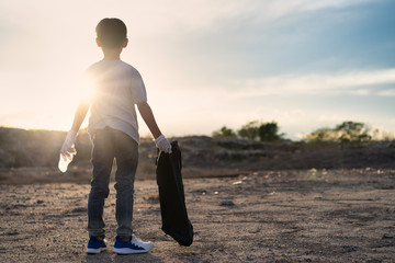 Kids volunteer help garbage collection charity environment. Improving environment. Energetic male...
