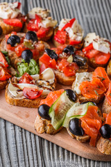 Assorted bruschetta Set of various appetizing snacks sandwiches
