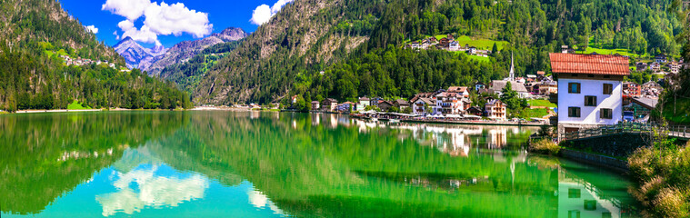 Wonderful lake Lago di Alleghe and beautiful village in Dolomites mountains, north of Italy