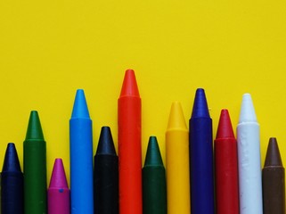 crayon color of child isolated on yellow background.