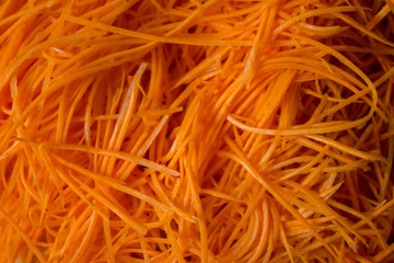 The carrots are polished on a turkish salt shaker. Carrot Background. Chopped carrot. Culinary background. copy space. top view. flat lay. background with blank space for text